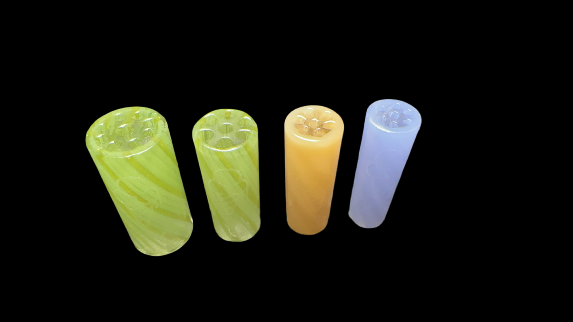 Five upright, translucent BLUE CONEZ glass cylinders from the CONEZ brand display marbled patterns against a black backdrop. Available in green, yellow, and blue, each piece features hollow sections on top.
